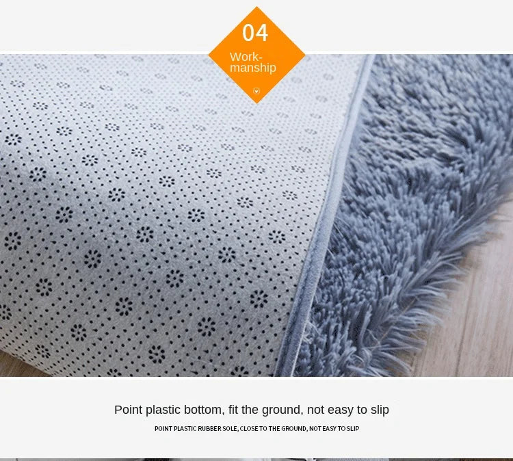 Close-up view of a gray tie-dyed plush floor mat showing the point plastic bottom texture.