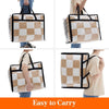 A beige and white checkered storage bag being held by a person, showing its size and texture.