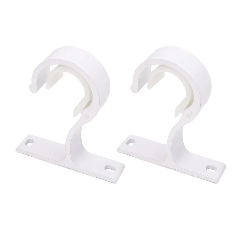 White multi-style curtain rod brackets designed for wall mounting.