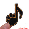 Black felt embroidered patch of a treble clef with a finger shape outline
