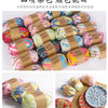Assortment of hand-dyed fabric strip yarn in various colors and patterns for crochet and knitting projects