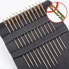 A black case containing a set of precision self-threading sewing needles with a magnified view of the needle tip