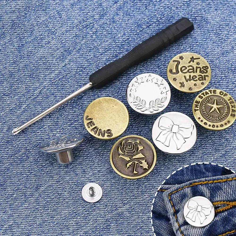 A metal jeans button repair kit featuring a screwdriver and multiple brass and silver buttons on a denim background.