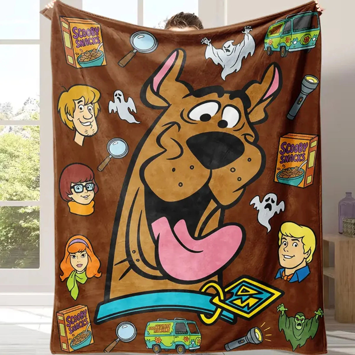 A brown flannel throw blanket featuring a large cartoon dog illustration and various Scooby Snacks related items.