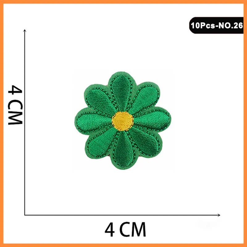 A set of 10 embroidered iron-on patches featuring a green flower with a yellow center.