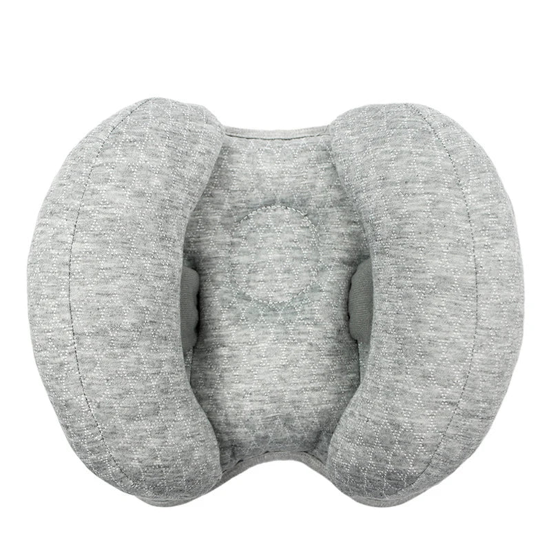 Gray baby head and neck support pillow designed for use in strollers and car seats