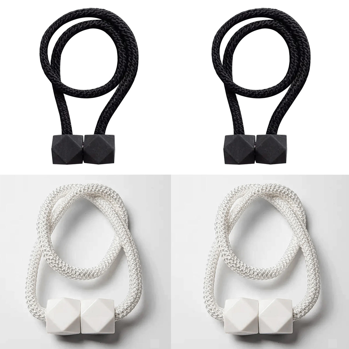 A set of four black magnetic curtain tiebacks and four white magnetic curtain tiebacks.