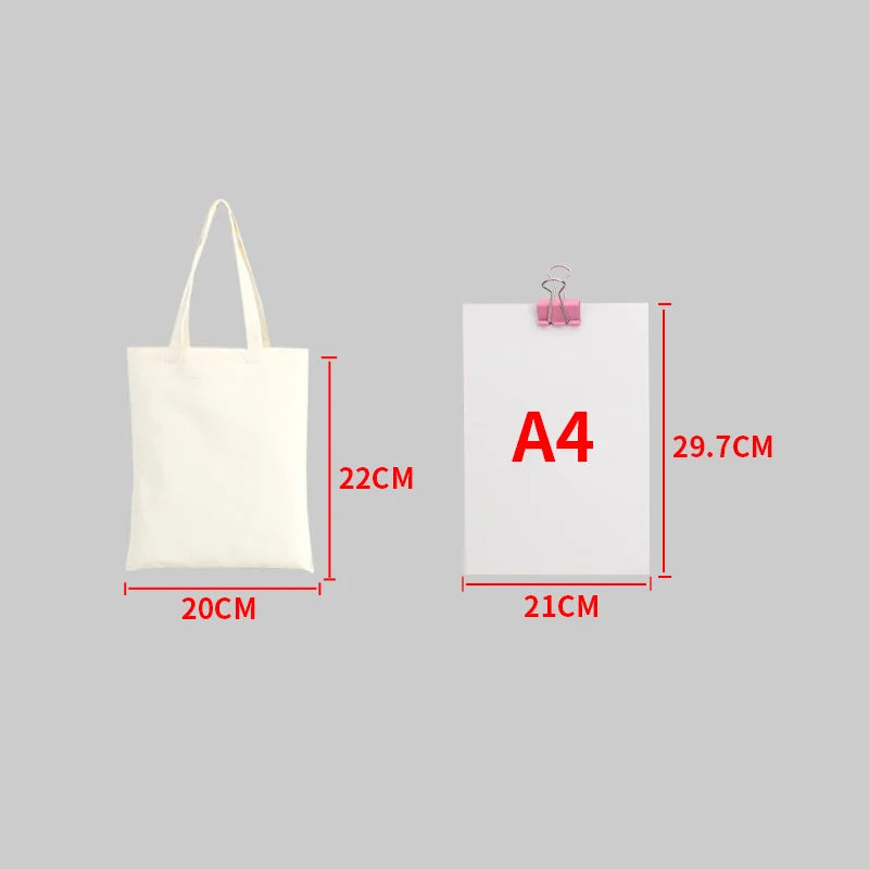 A white canvas tote bag with handles shown next to an A4 sized white paper document.