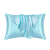 A light blue silk pillow cover with draped folds.