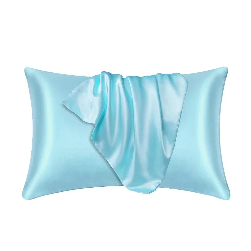 A light blue silk pillow cover with draped folds.