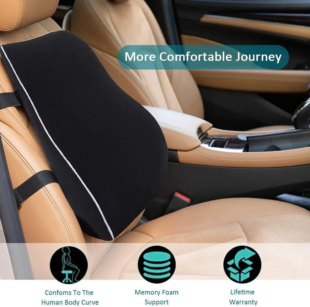 A memory foam lumbar support pillow with non-slip backing shown in a car seat interior.