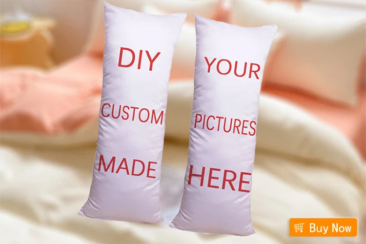 Two white pillows with red text DIY YOUR CUSTOM MADE HERE displayed on a light pink background.