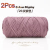 Two skeins of mauve elastic yarn used for crafting with a color display.