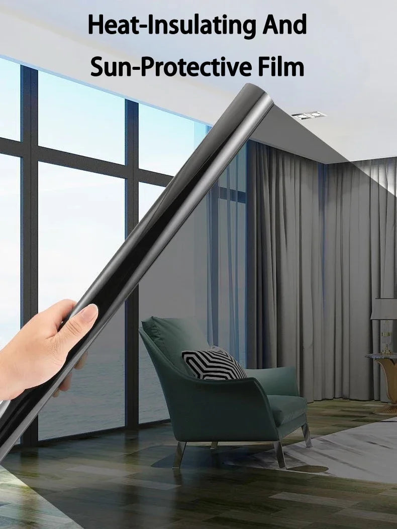 A hand holds a black heat-insulating and sun-protective film, demonstrating its use on a window.