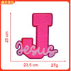 Pink iron-on embroidery patch shaped like the letter T with the word Jesus written below