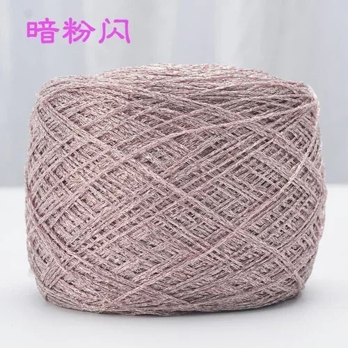 A ball of metallic pink silk yarn used for crocheting and knitting.