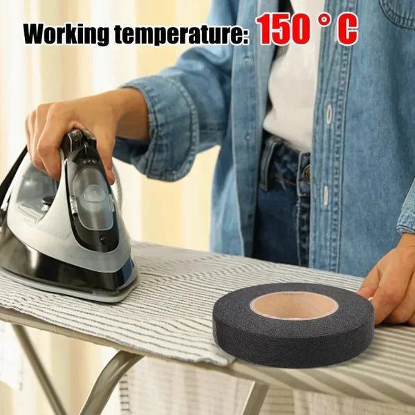 A hand is applying double-sided heat-resistant interlining tape to a sewing project on a table.