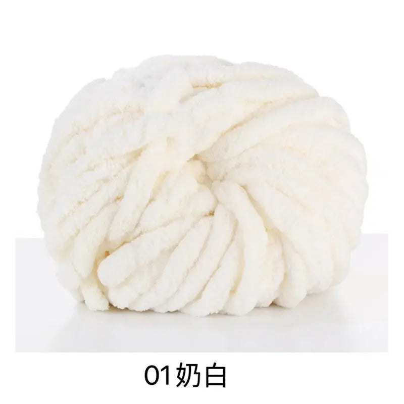 A ball of white chunky acrylic yarn for knitting and crochet projects.
