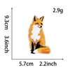 An embroidery patch depicting a fox in an orange and white color scheme.