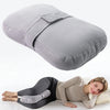 A gray ergonomic knee pillow is shown next to a woman lying down.