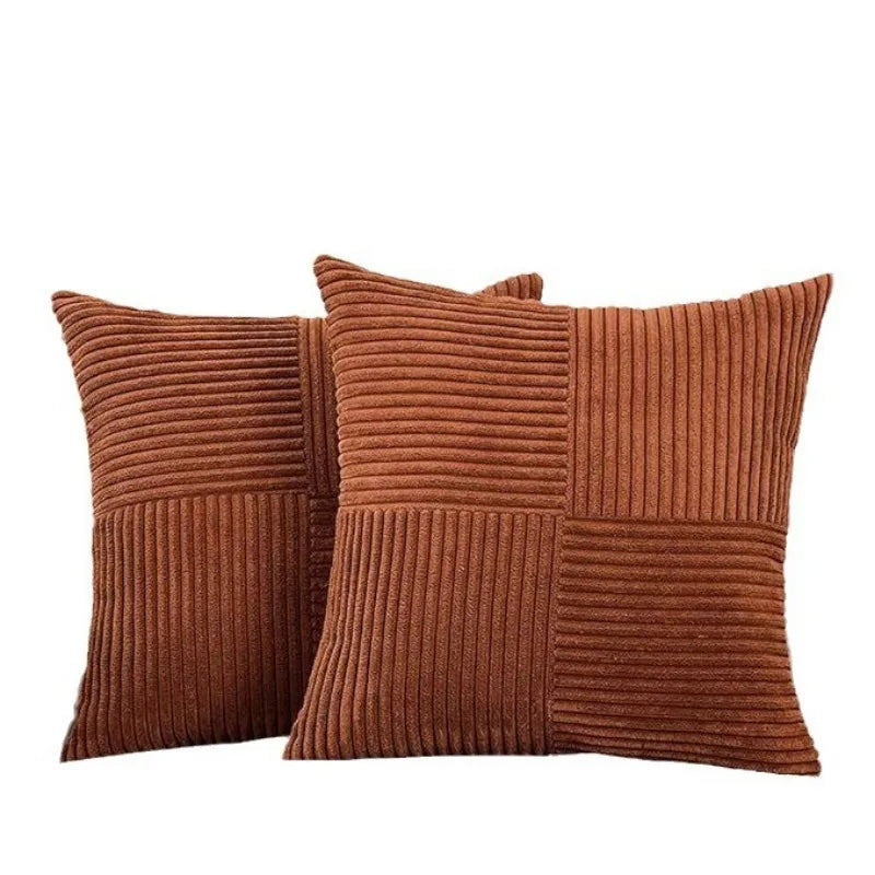 Two brown corduroy patchwork pillow covers with vertical ribbed texture