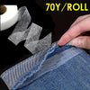 Roll of 70 yards of fusible hem tape being applied to denim fabric for sewing