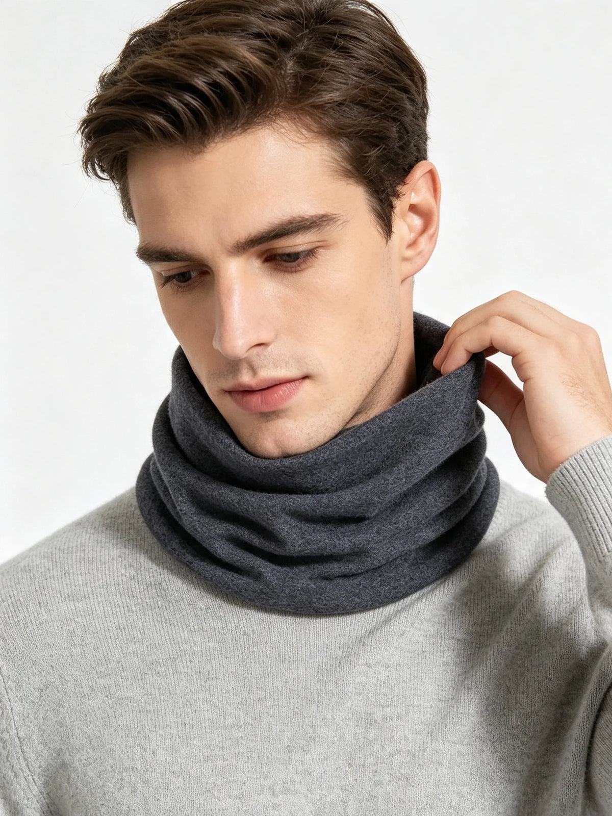 A man wearing a gray sweater and a dark gray soft cotton warm neck scarf