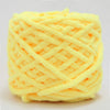 A ball of bright yellow chenille knitting yarn used for hand crafting.