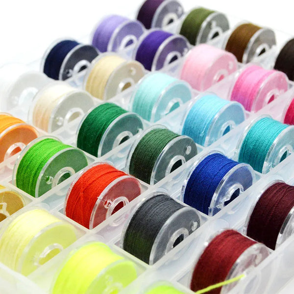 Assortment sewing thread bobbins set showing various colors of thread spools.