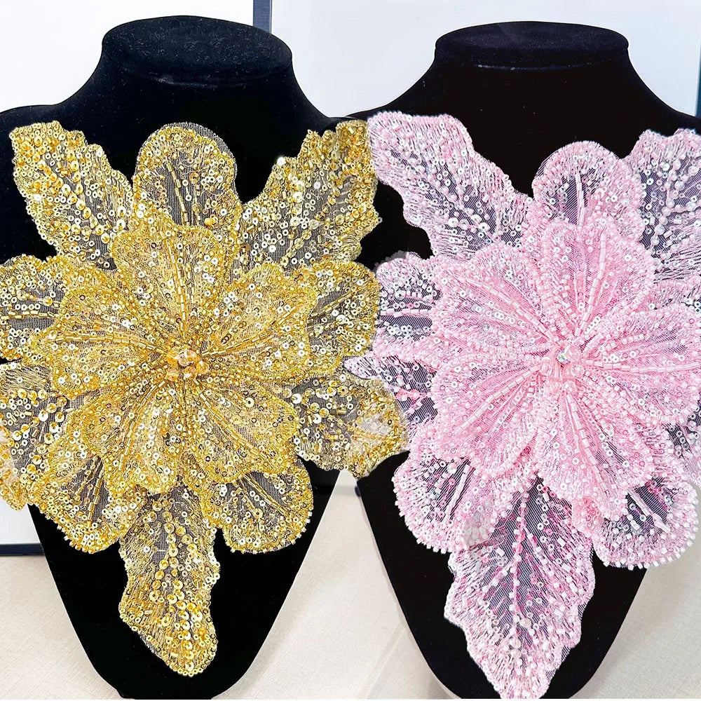 Gold and pink 3D floral sequin lace applique fabric patches displayed on black mannequins.
