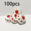A collection of 100 oil-proof baking cups with a red strawberry pattern arranged on a white surface.