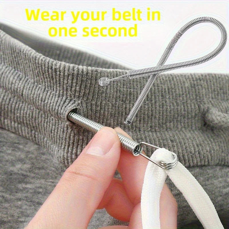 A hand is using an adjustable spring drawstring threader clip to quickly put a belt through a garment.