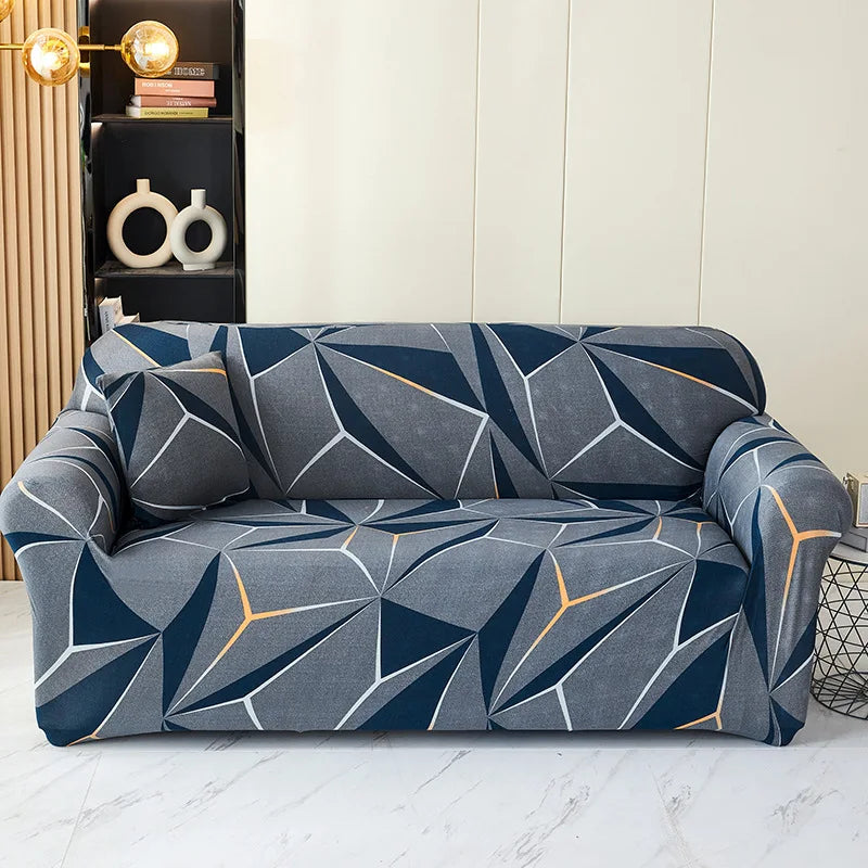 A modern gray sofa covered in a geometric pattern of dark blue and orange triangles.