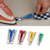 A set of five bias tape makers with various colored awl tools for sewing and quilting.