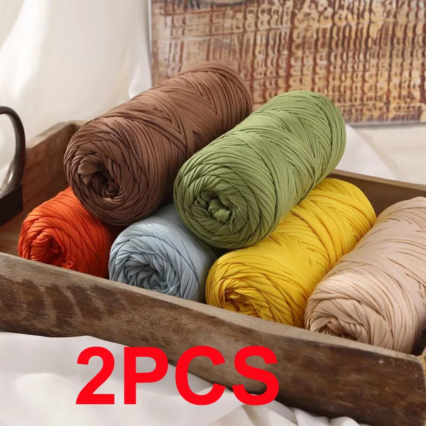 Five spools of reusable elastic yarn in various colors including terracotta, olive green, light blue, yellow, and beige, disp