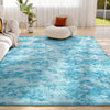 A bright blue shaggy rug with white tips is placed on a wooden floor in a bright living room setting.