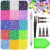 A collection of various colored and sized glitter and rhinestones in a plastic tray for crafting and decoration