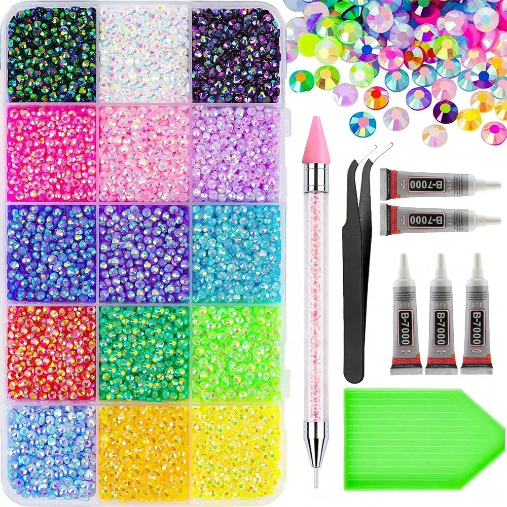 A collection of various colored and sized glitter and rhinestones in a plastic tray for crafting and decoration