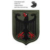 A dark olive green embroidered patch featuring a black eagle design on a fabric background.