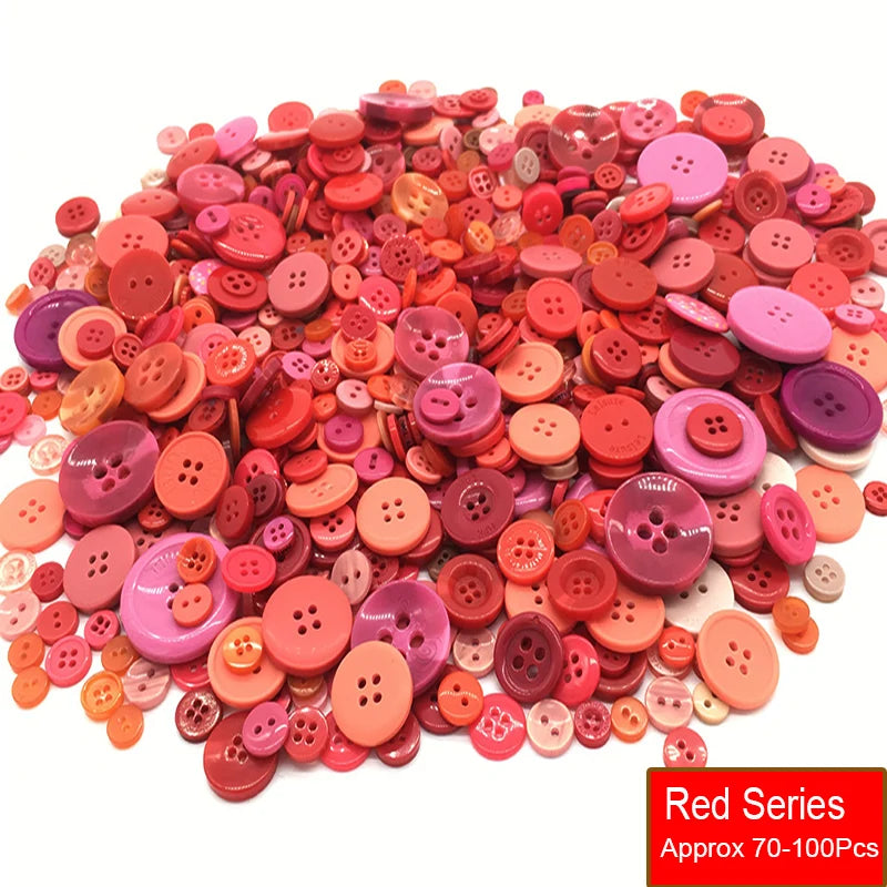A pile of assorted resin sewing buttons in various shades of red and pink for crafting projects