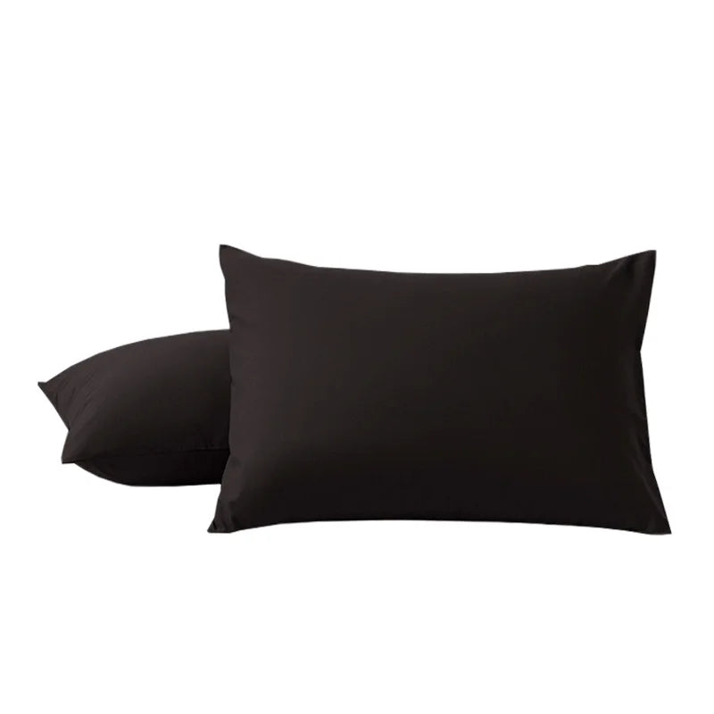 A pair of black microfiber pillow covers shown flat.
