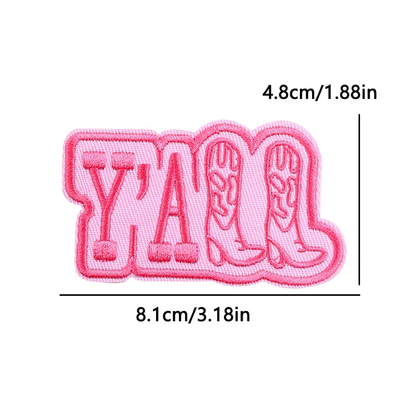 Pink embroidered patch featuring the letters Y A M with a heart design.
