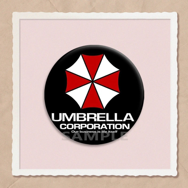 A black circular pin featuring a red and white umbrella design on a light pink background.
