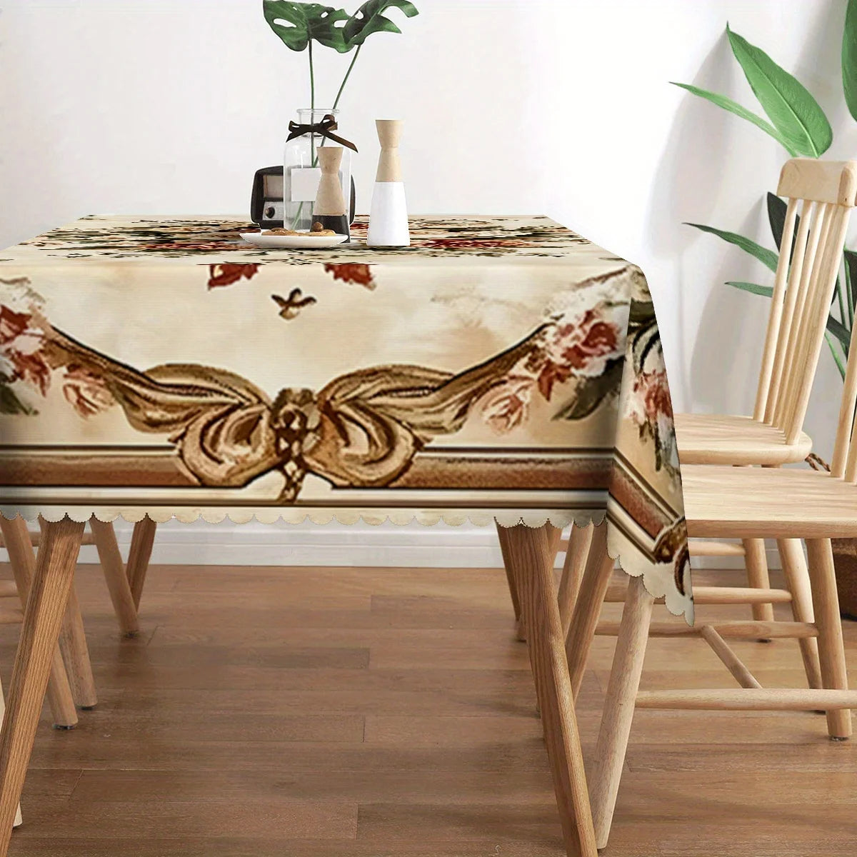 Elegant floral lace rectangular tablecloth displayed on a wooden table with matching chairs.