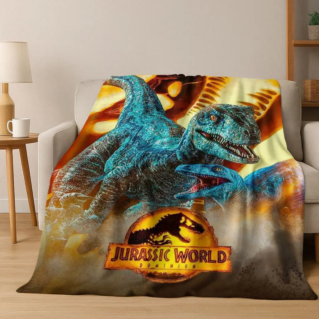 A blanket featuring a large blue dinosaur, likely a Tyrannosaurus Rex, on a yellow background.