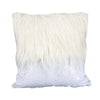 White cushion cover with long white fur trim and a sequin fabric base.