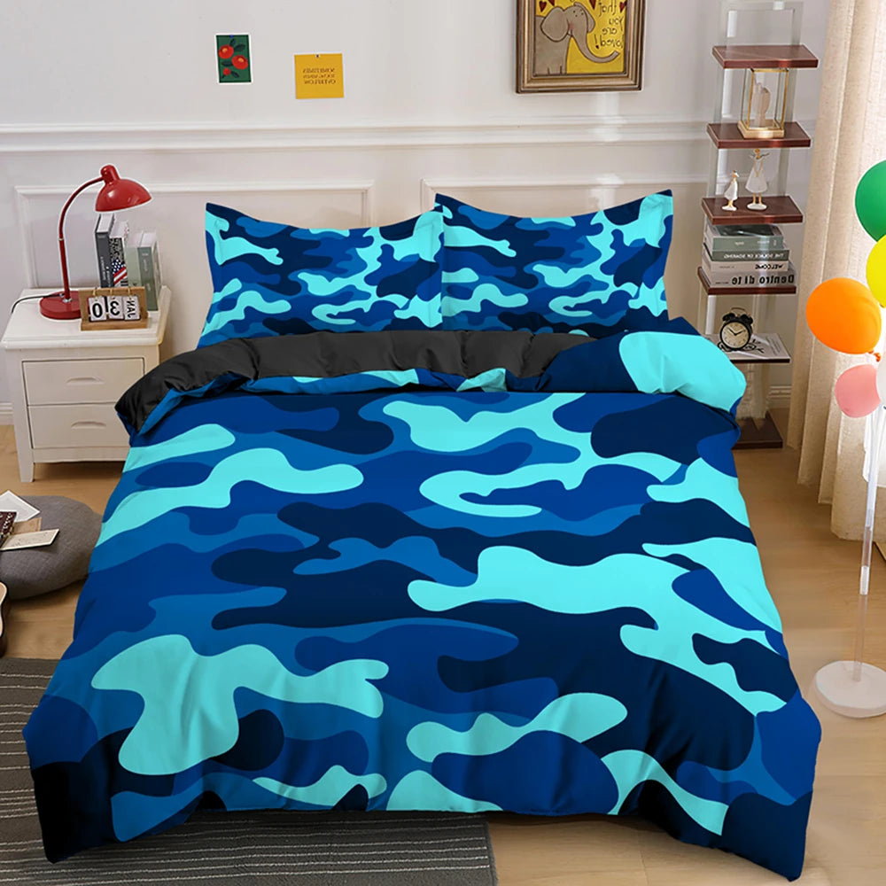 A blue and teal camouflage duvet cover set displayed on a bed with white nightstands and decorative items.