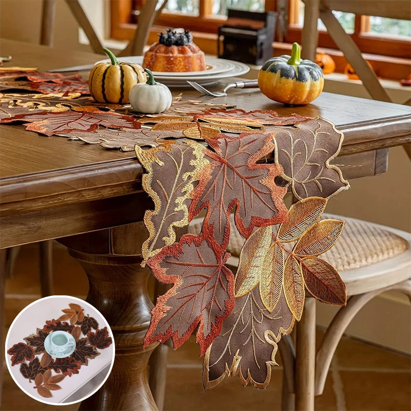 A rustic farmhouse maple leaf table runner in shades of brown and orange on a wooden table.