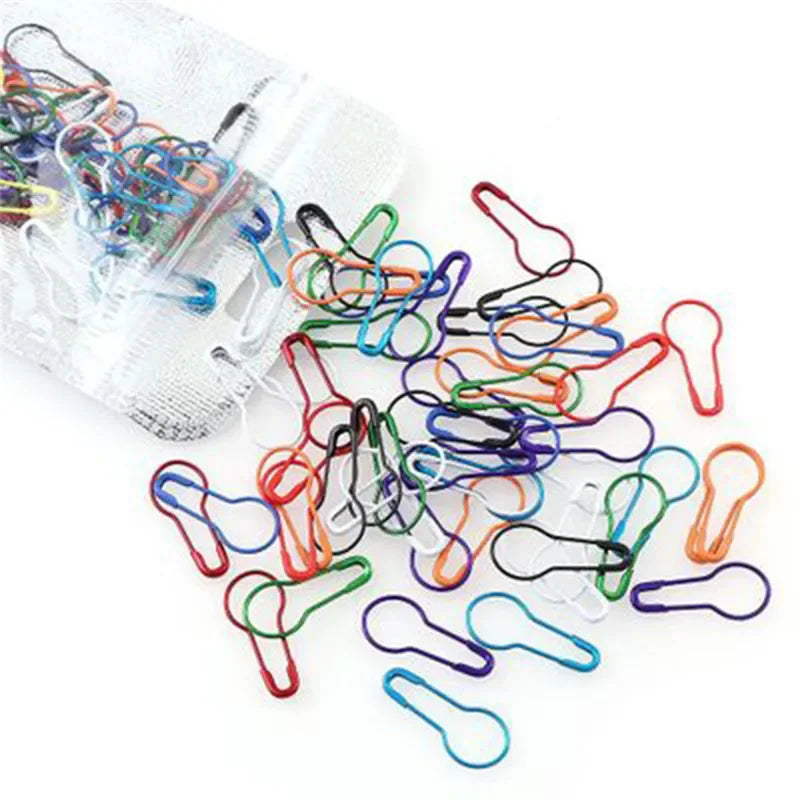 A collection of colorful safety bulb pins for knitting and sewing, packaged in a clear plastic bag.