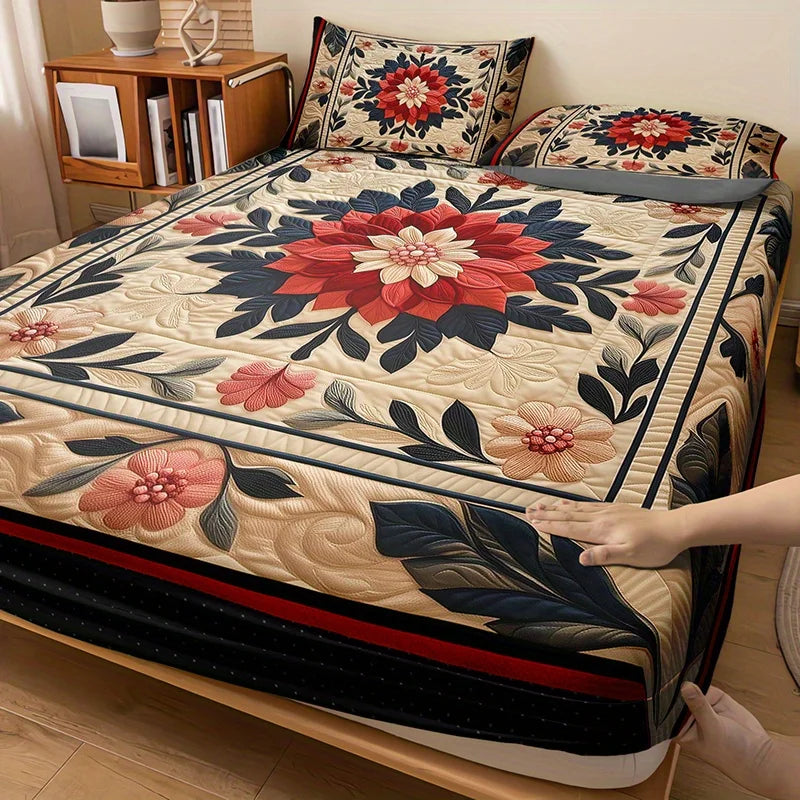 A floral print fitted sheet set featuring red, pink, and blue patterns on a bed.